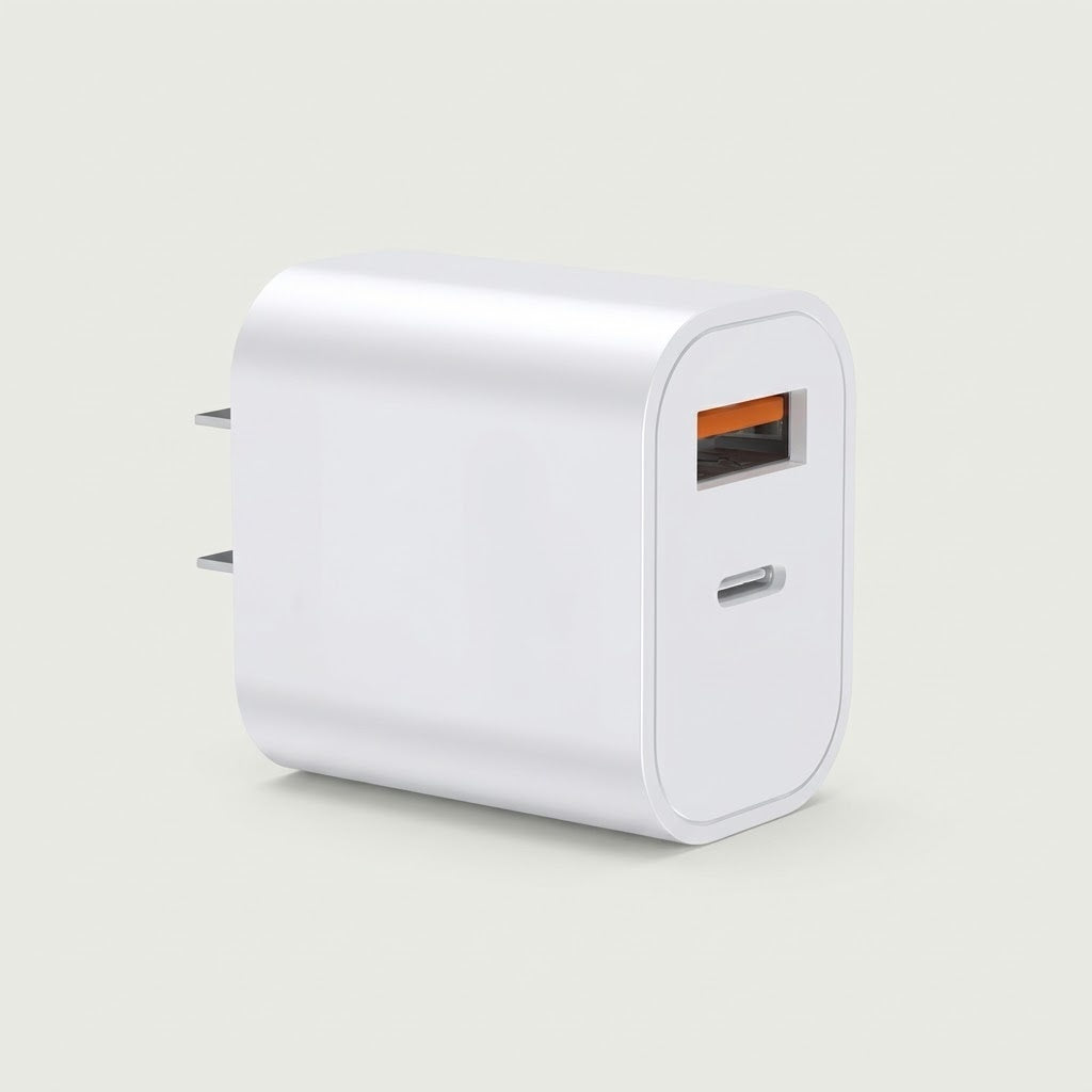 White 20W dual-port USB-C and USB-A fast wall charger with folding US plug, studio shot