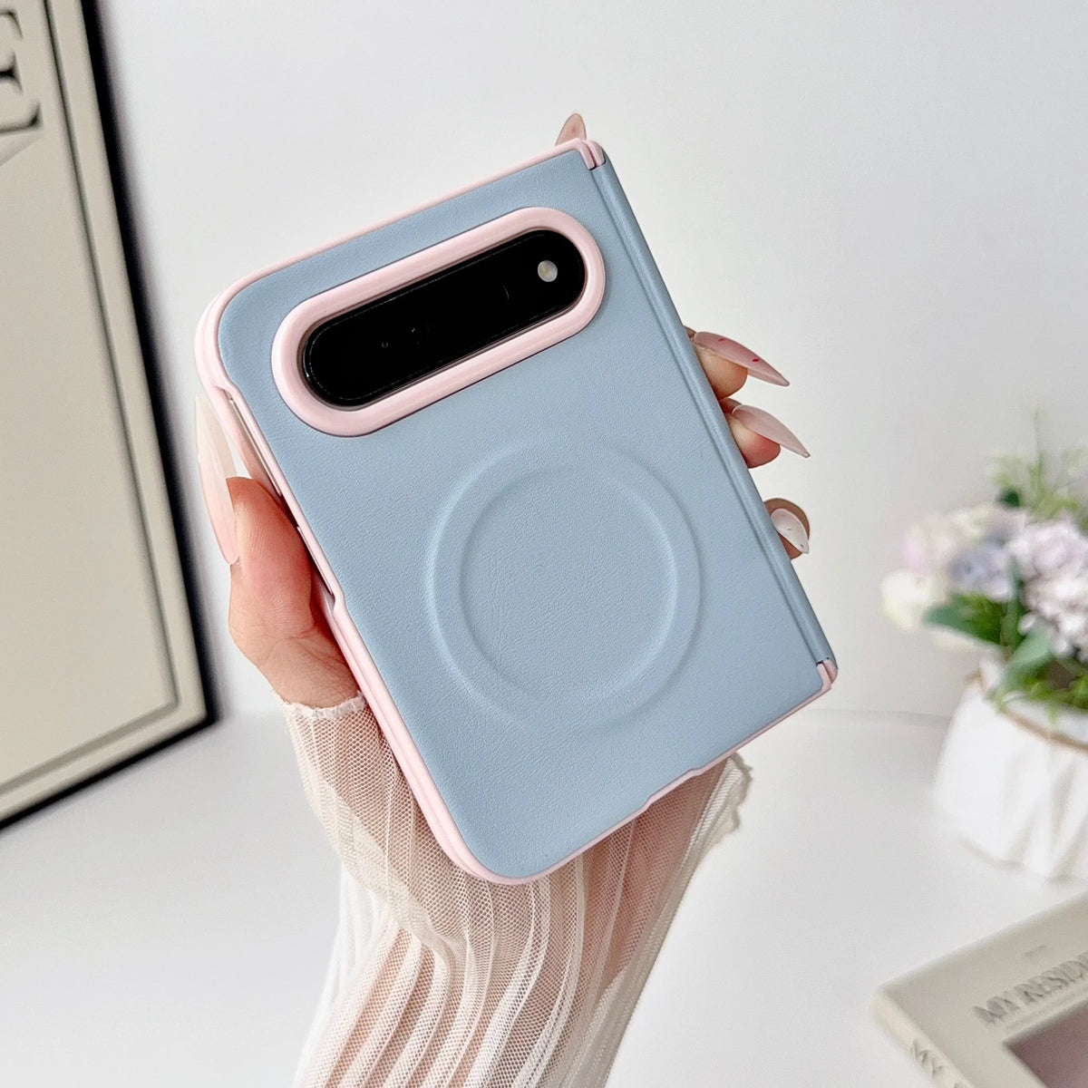 Blue leather colourblock case with pink camera rim on iPhone Duo