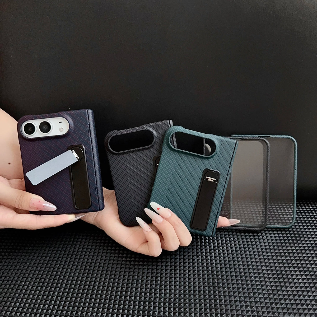Kevlar-style metal-stand case shown in black, navy and green colourways