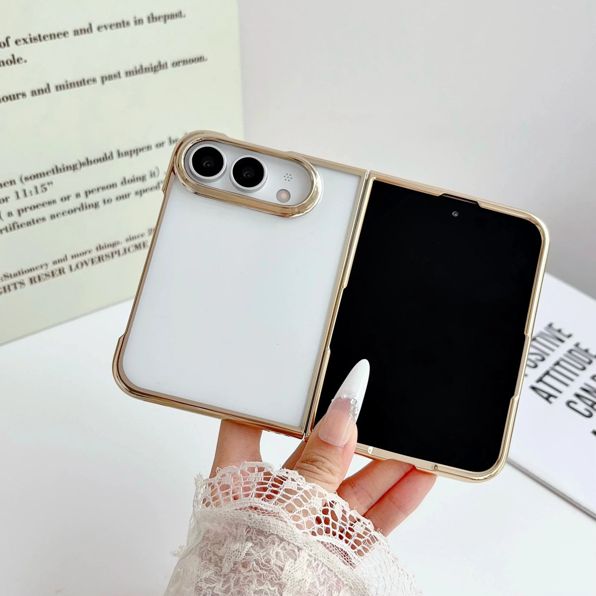 Electroplated clear case with gold trim, device half open