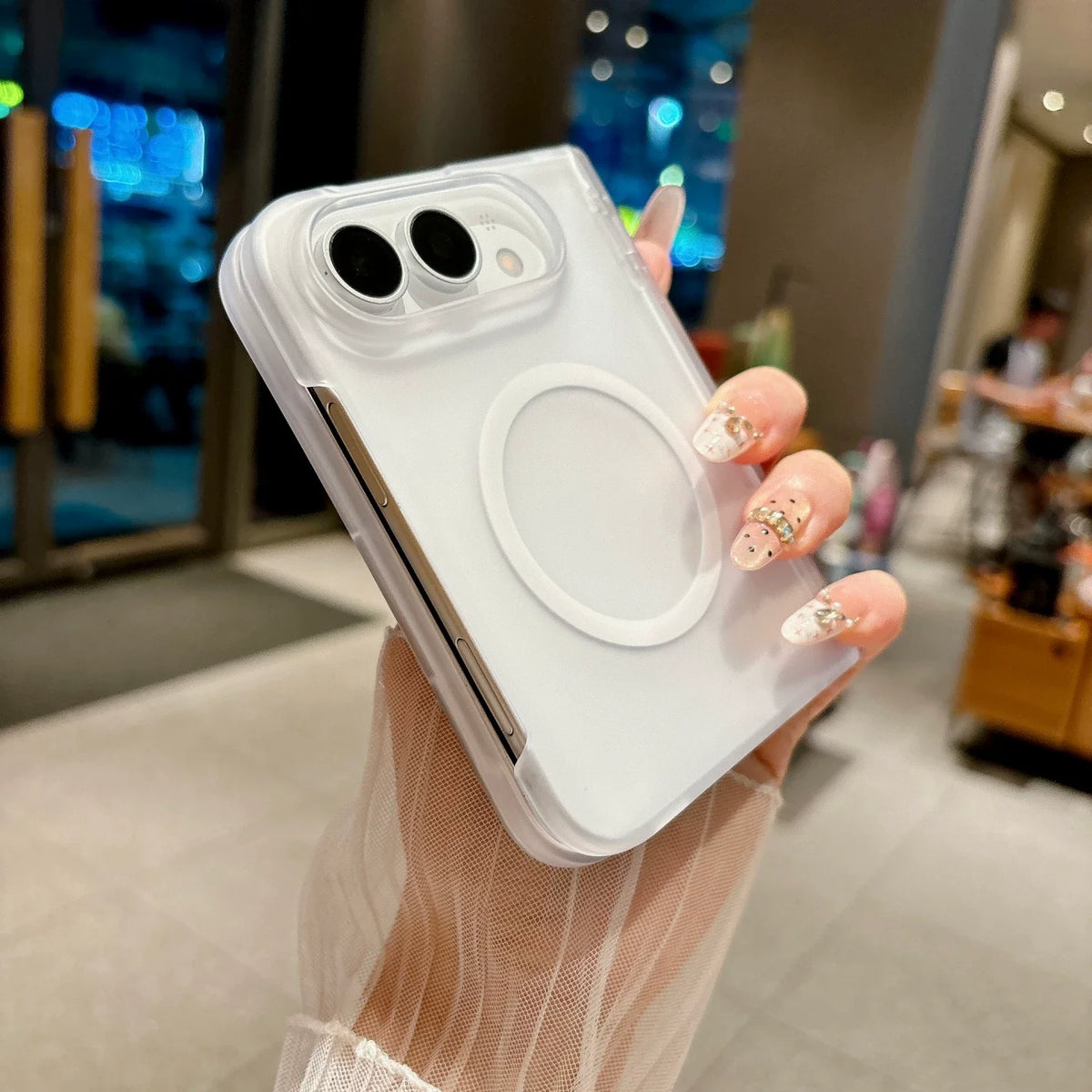 Ultra-thin frosted white shell on iPhone Duo held in hand