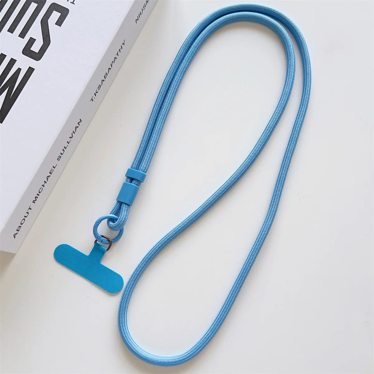 Long crossbody phone lanyard with case connection clip, blue