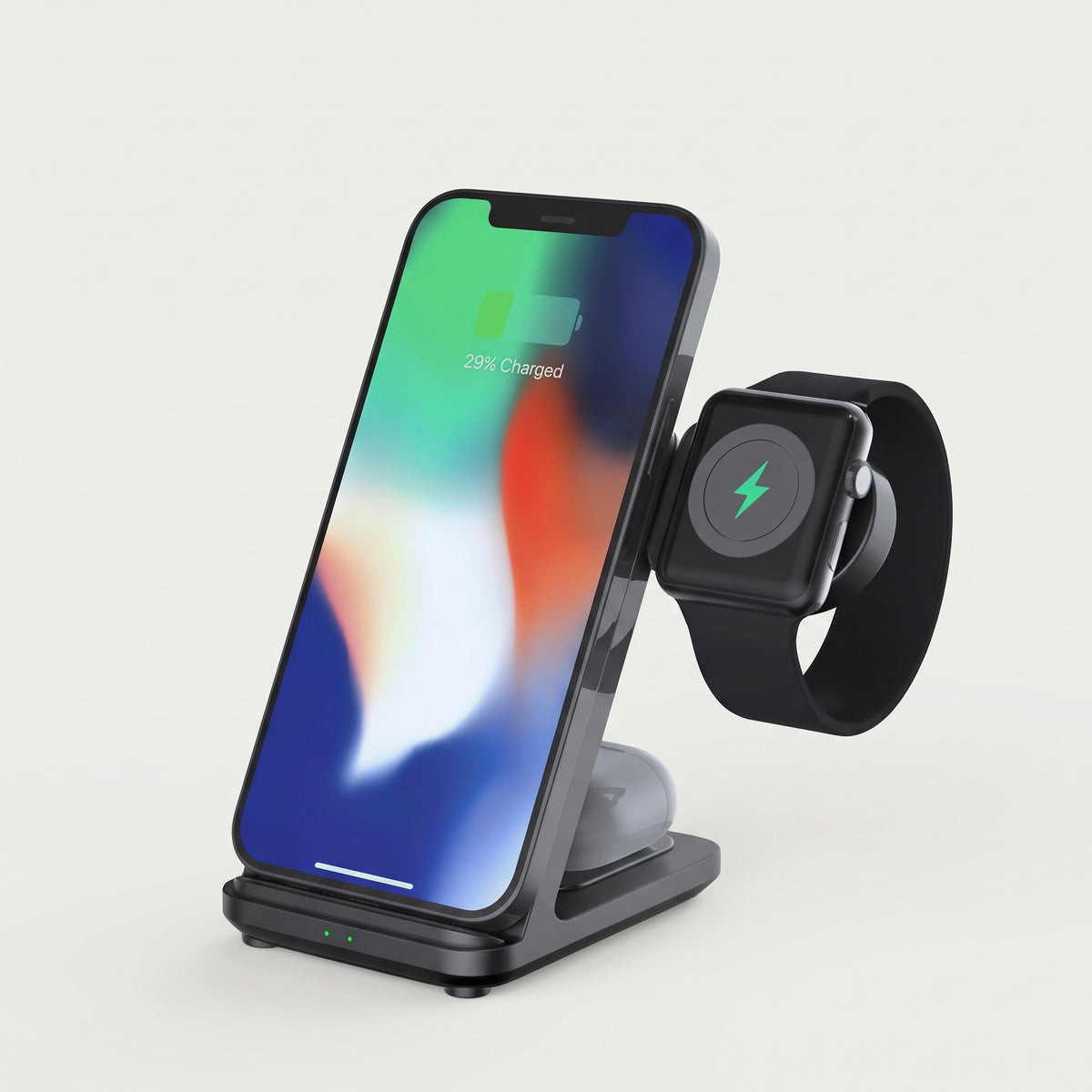 Black detachable 3-in-1 wireless charging stand charging an iPhone and Apple Watch, studio shot