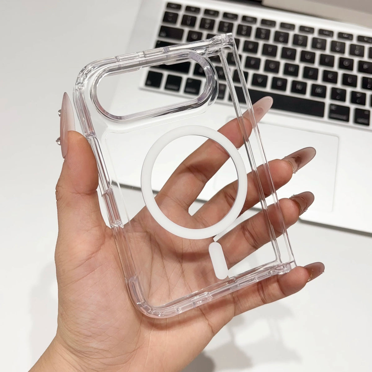 Clear MagSafe case for iPhone Duo held up, magnet ring through the clear back